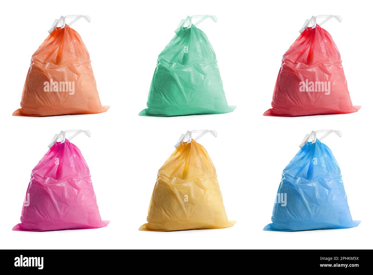 Trash bags full of garbage on pink background Stock Photo - Alamy
