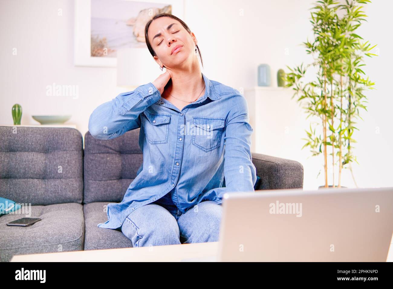 Woman suffering pain caused by poor posture ergonomics Stock Photo Alamy