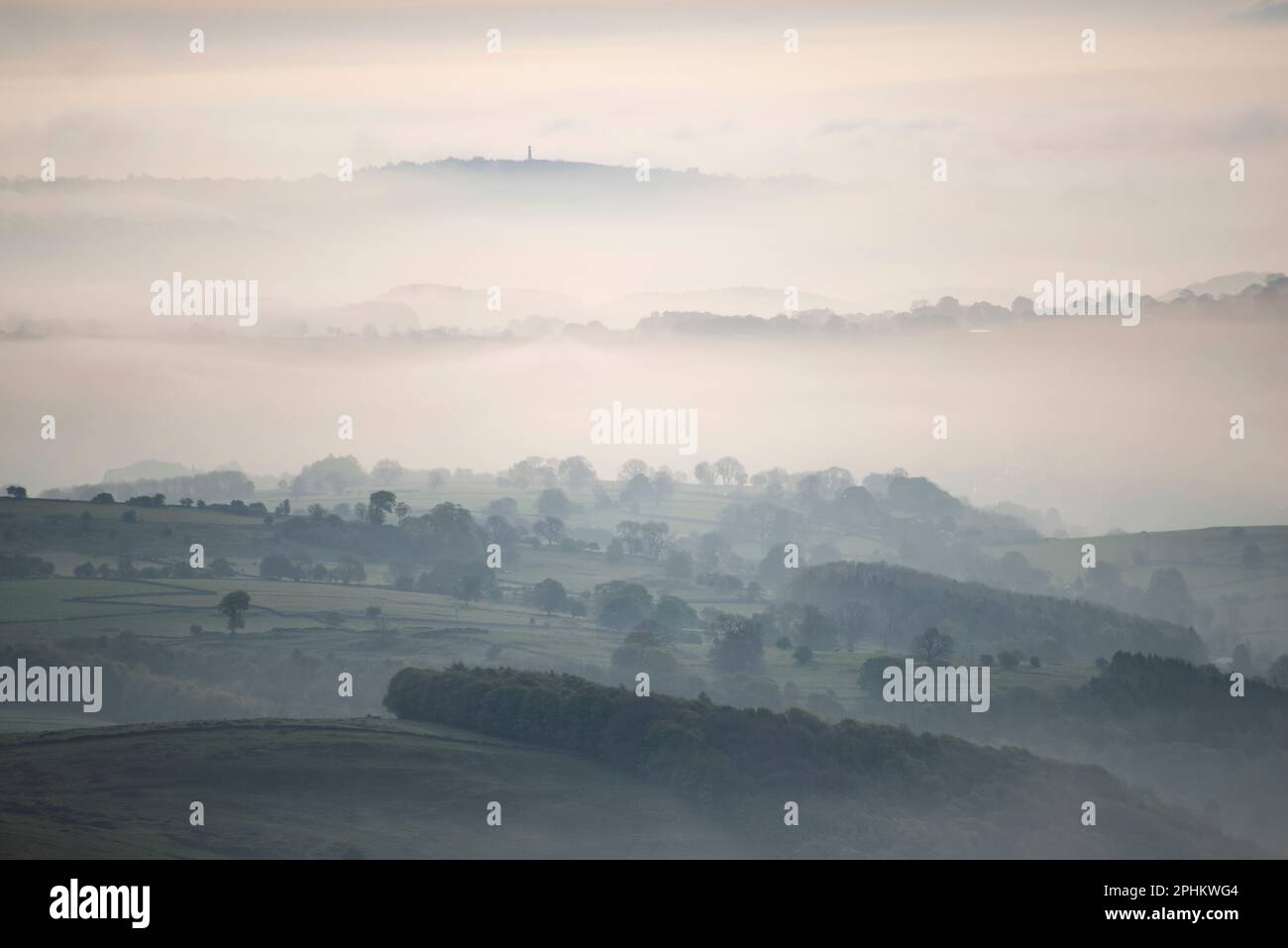A misty spring morning with fog in the valleys from a hot air ballon ...