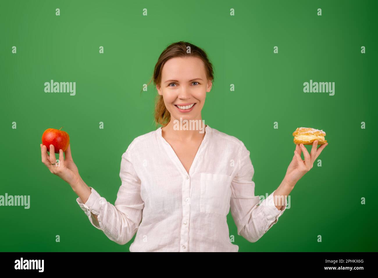 Woman With Four Arms Holding Fruit And Cakes In Each Hand Stock