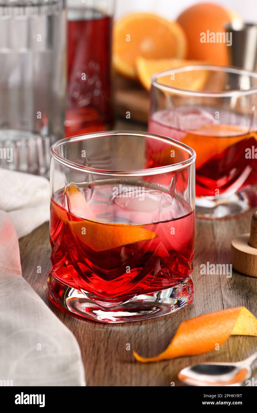 A classic Negroni made with equal parts Campari, gin and sweet vermouth and garnished with orange zest. The perfect aperitif before dinner Stock Photo