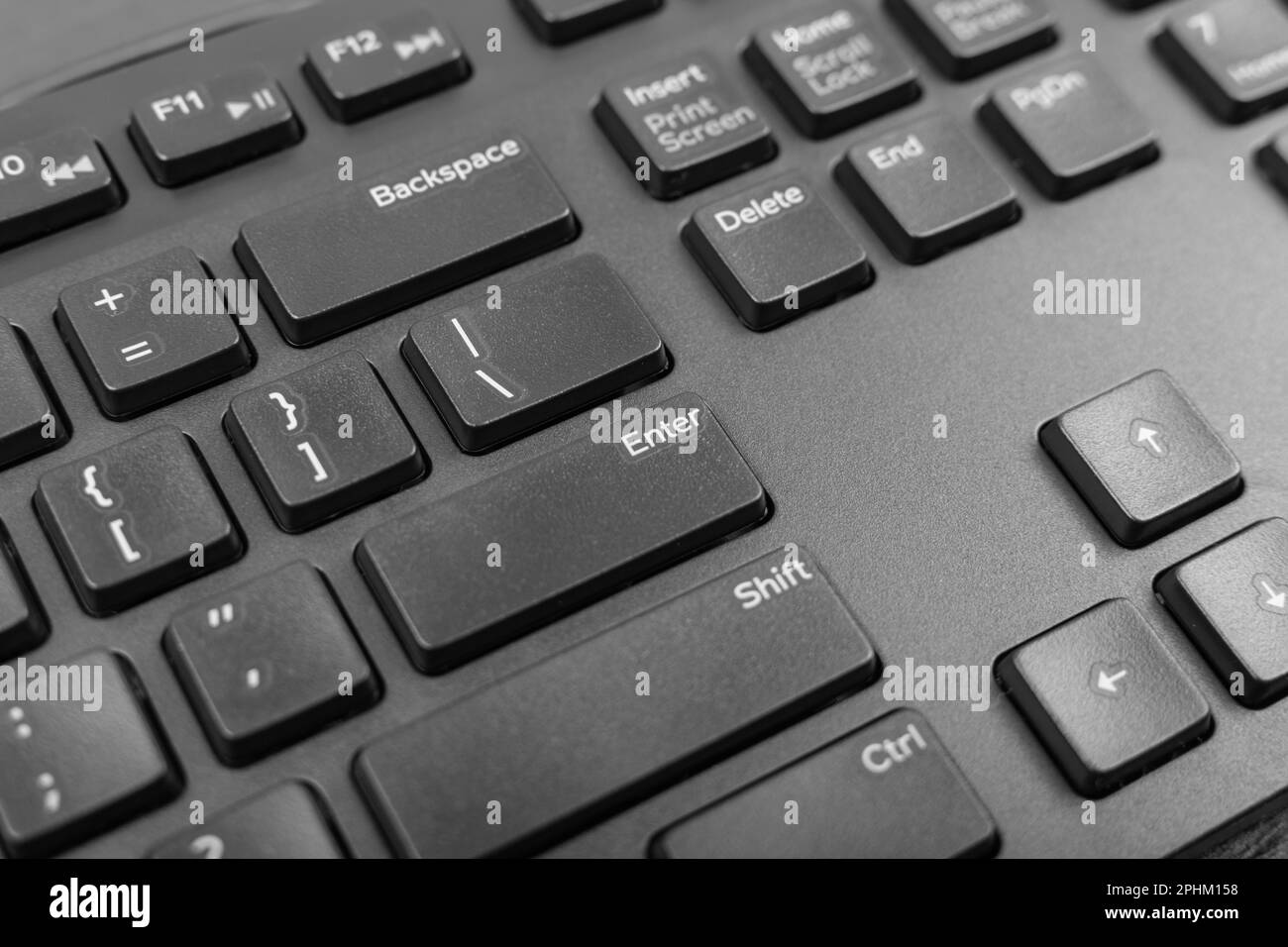 Black keyboard keys closeup. Macro shot of Enter keyboard button, pc hotkey, keystroke photo Stock Photo