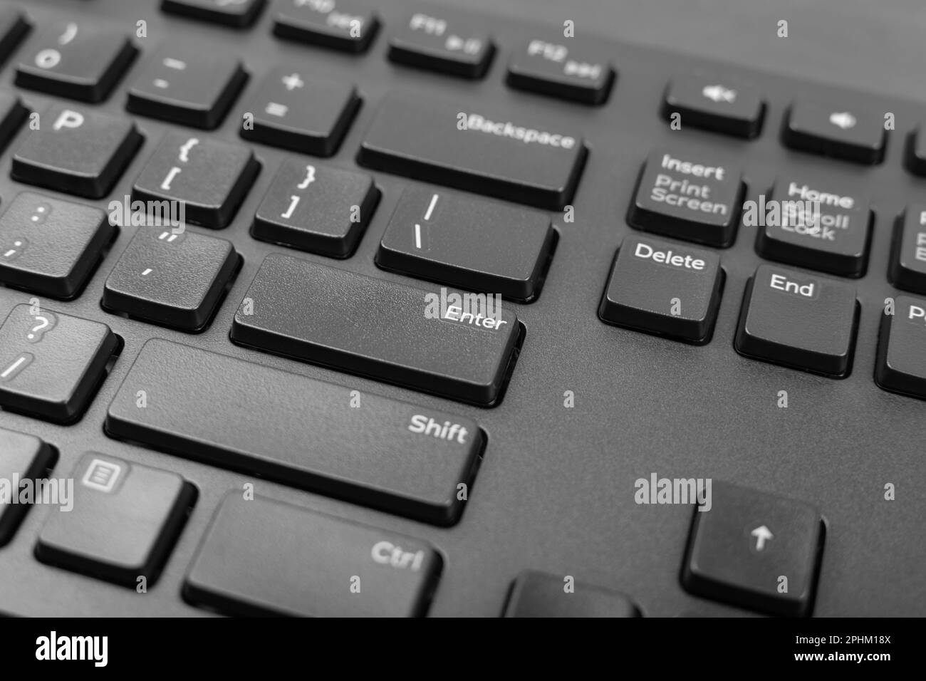 Black keyboard keys closeup. Macro shot of Enter keyboard button, pc hotkey, keystroke photo Stock Photo