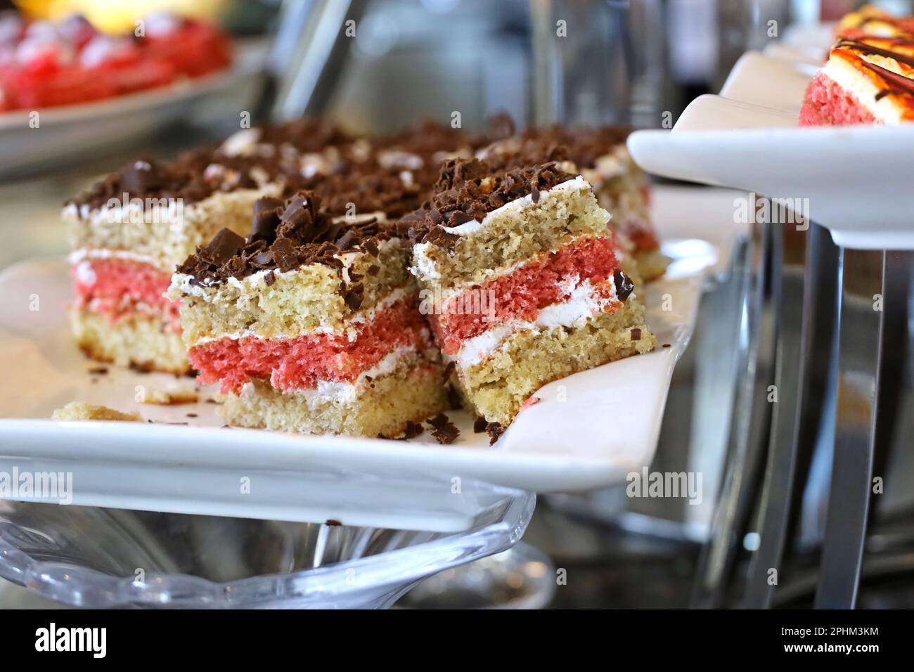 Sponge cakes sprinkled with grated chocolate in restaurant ...