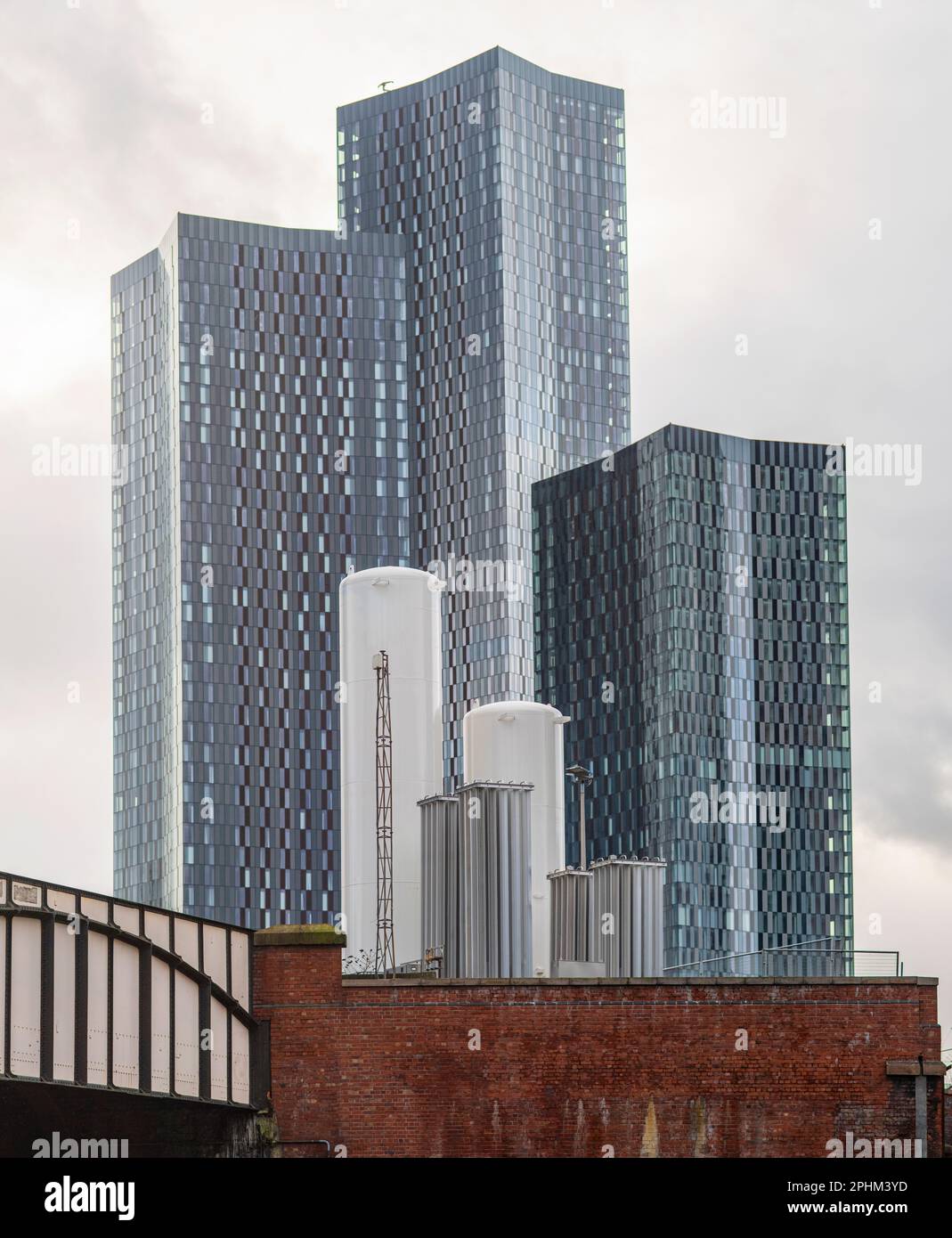 Containers for construction, holding cement, concreate to build towers like those beyond. Development of towers in Manchester city center Stock Photo
