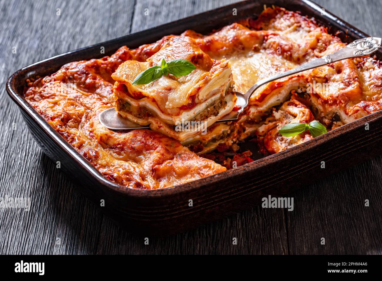 Lasagna with ricotta cheese, ground beef, mushrooms, and tomato sauce