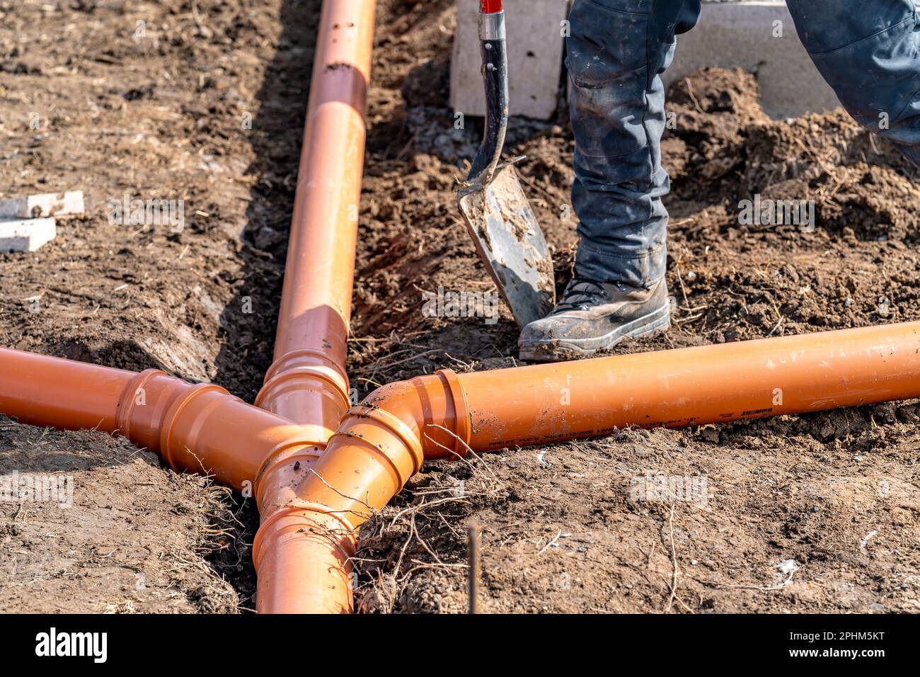 installation of a sewage plastic pipe during the construction of a