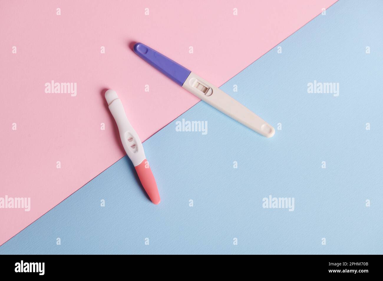 Ink Positive Top view positive inkjet pregnancy tests isolated on blue pink ...