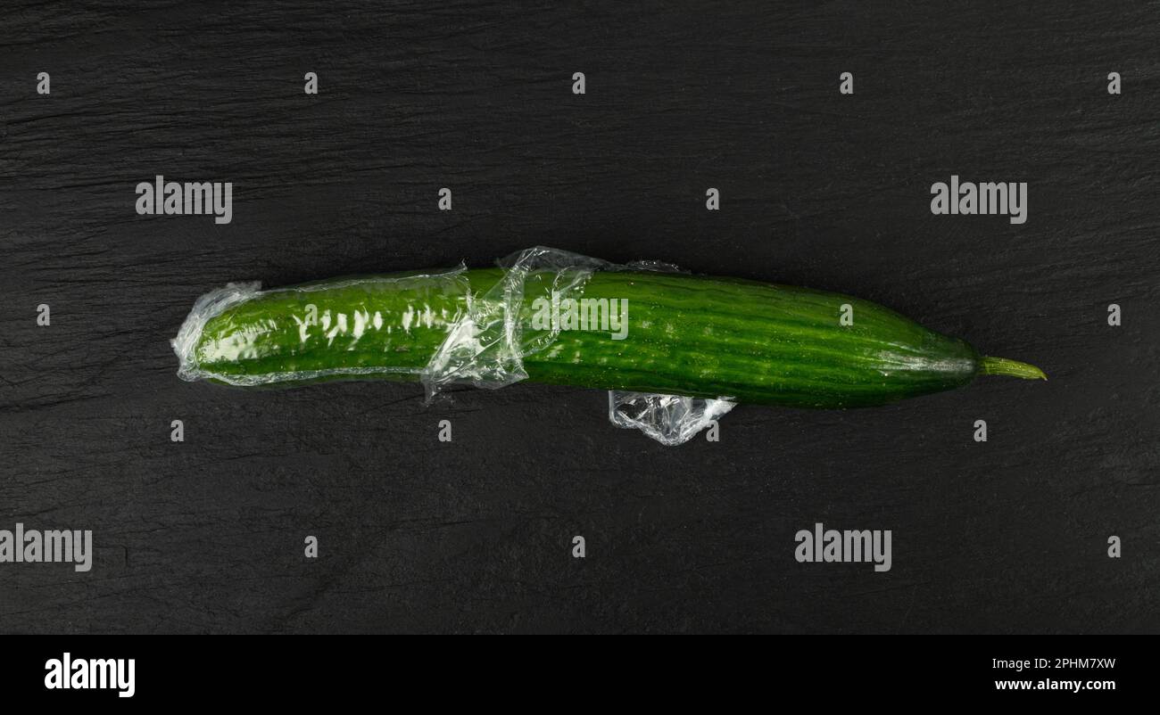 Plastic Wrapped Cucumber, Vegetable in Film Packaging, Film Wrap Food, Eat Plastic Concept