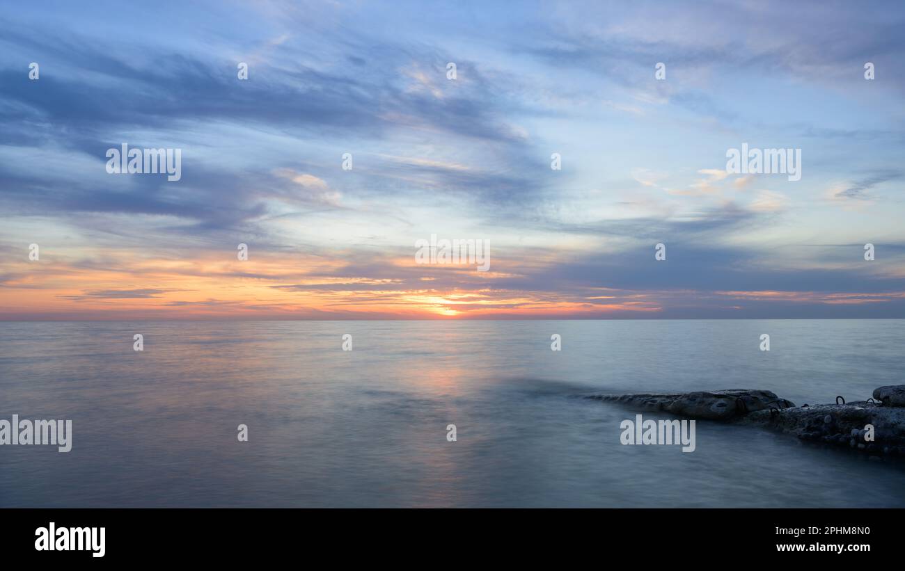 Sunset at the beach in Ault (France) on a cloudy evening in summer Stock Photo