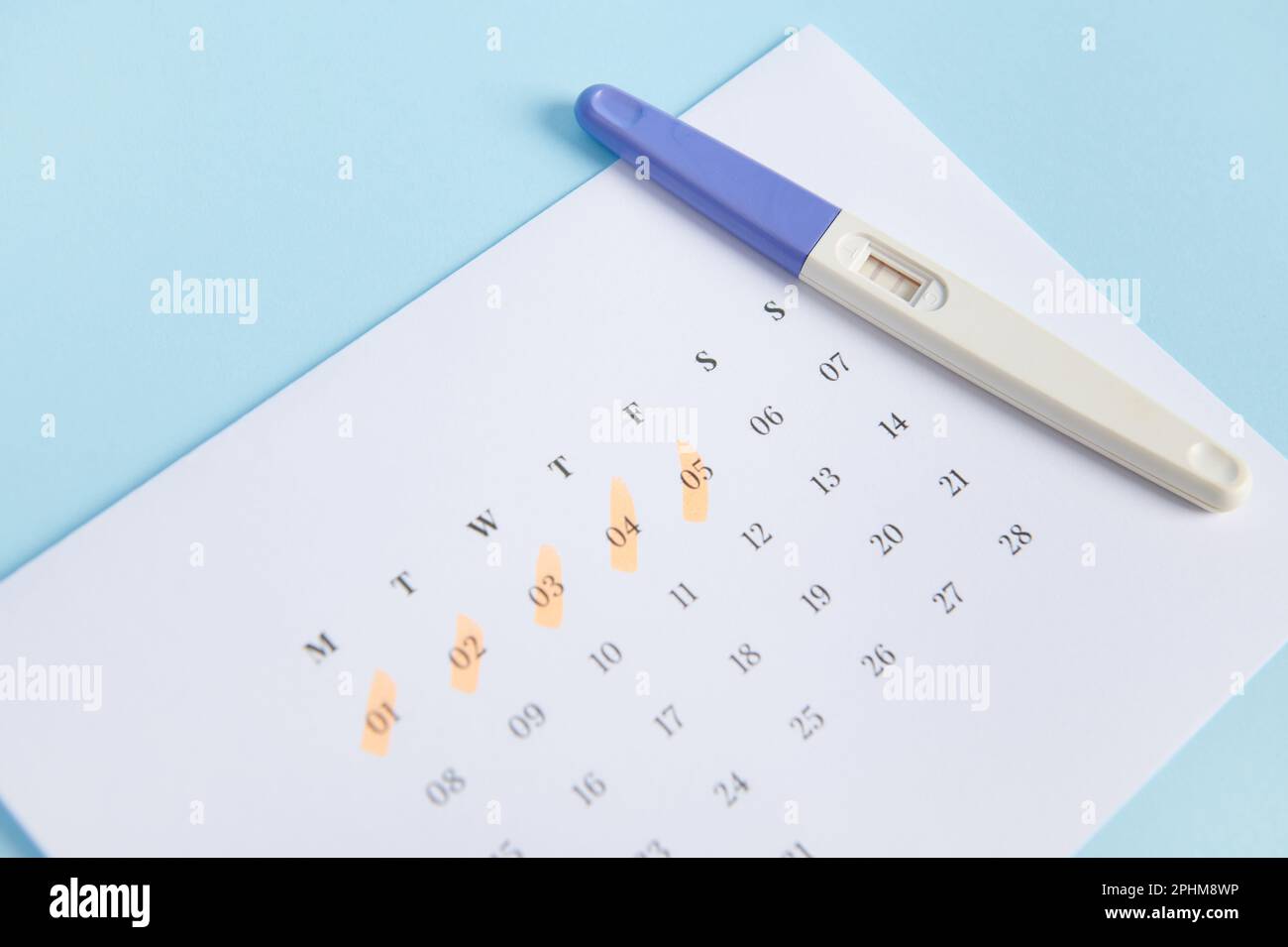 Calculating ovulation planning and diagnosis pregnancy Test kit on a