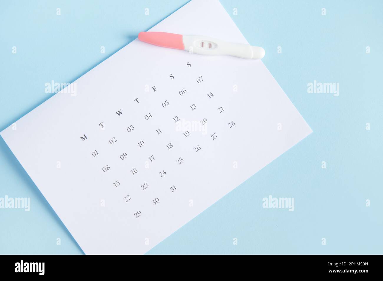 calculating-ovulation-planning-and-diagnosis-pregnancy-test-kit-on-a