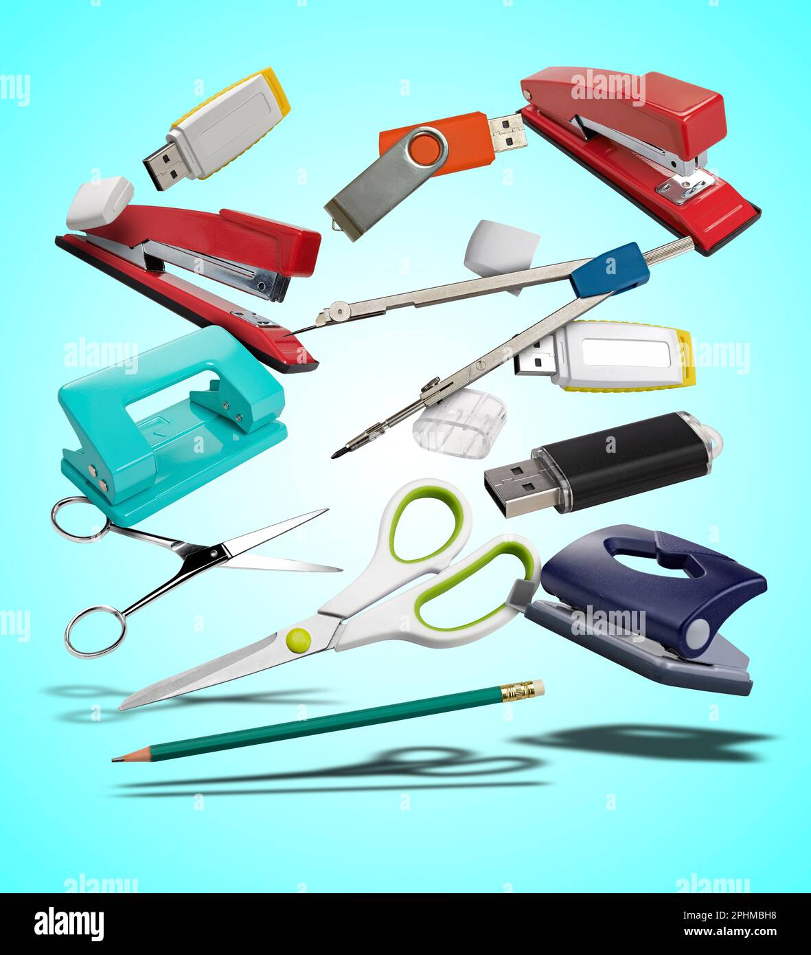 Floating  desk utilities and tools on cyan radial gradient background Stock Photo