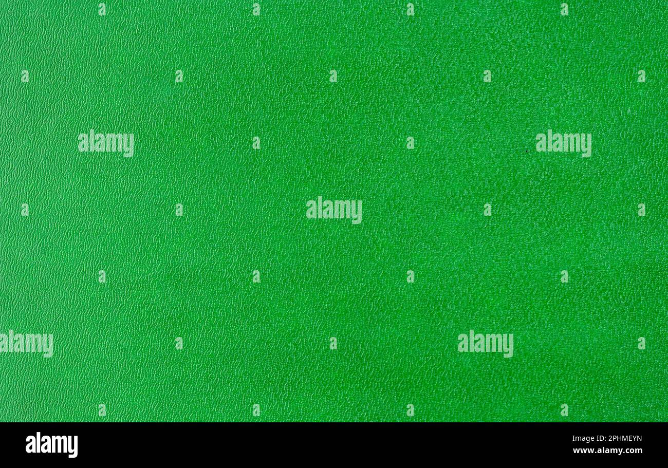 Rough bright hard green cardboard, sheet as texture, background or backdrop for holiday decoration Stock Photo