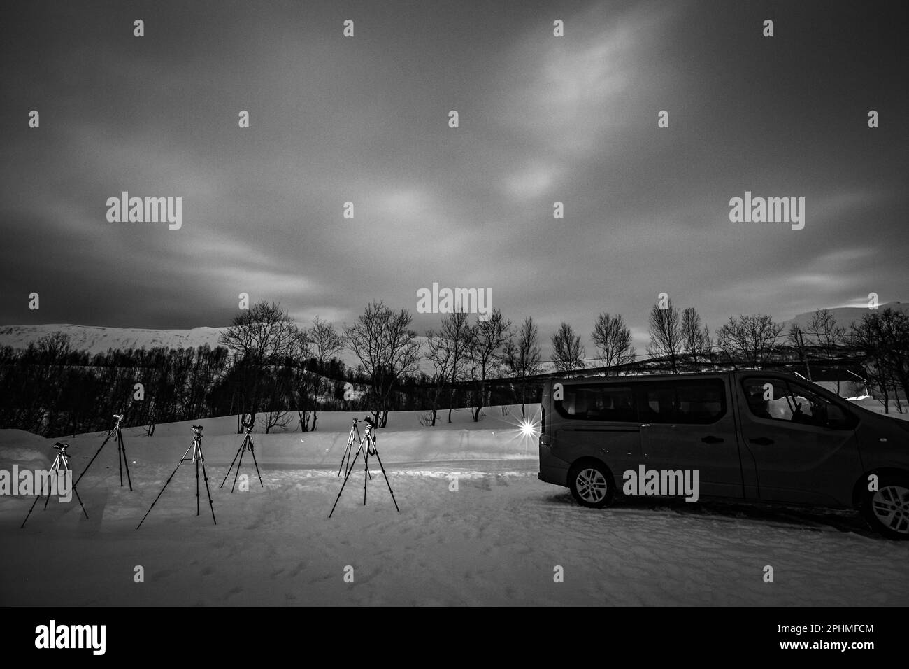 Long exposure, black and white, photographers at night in polar circle