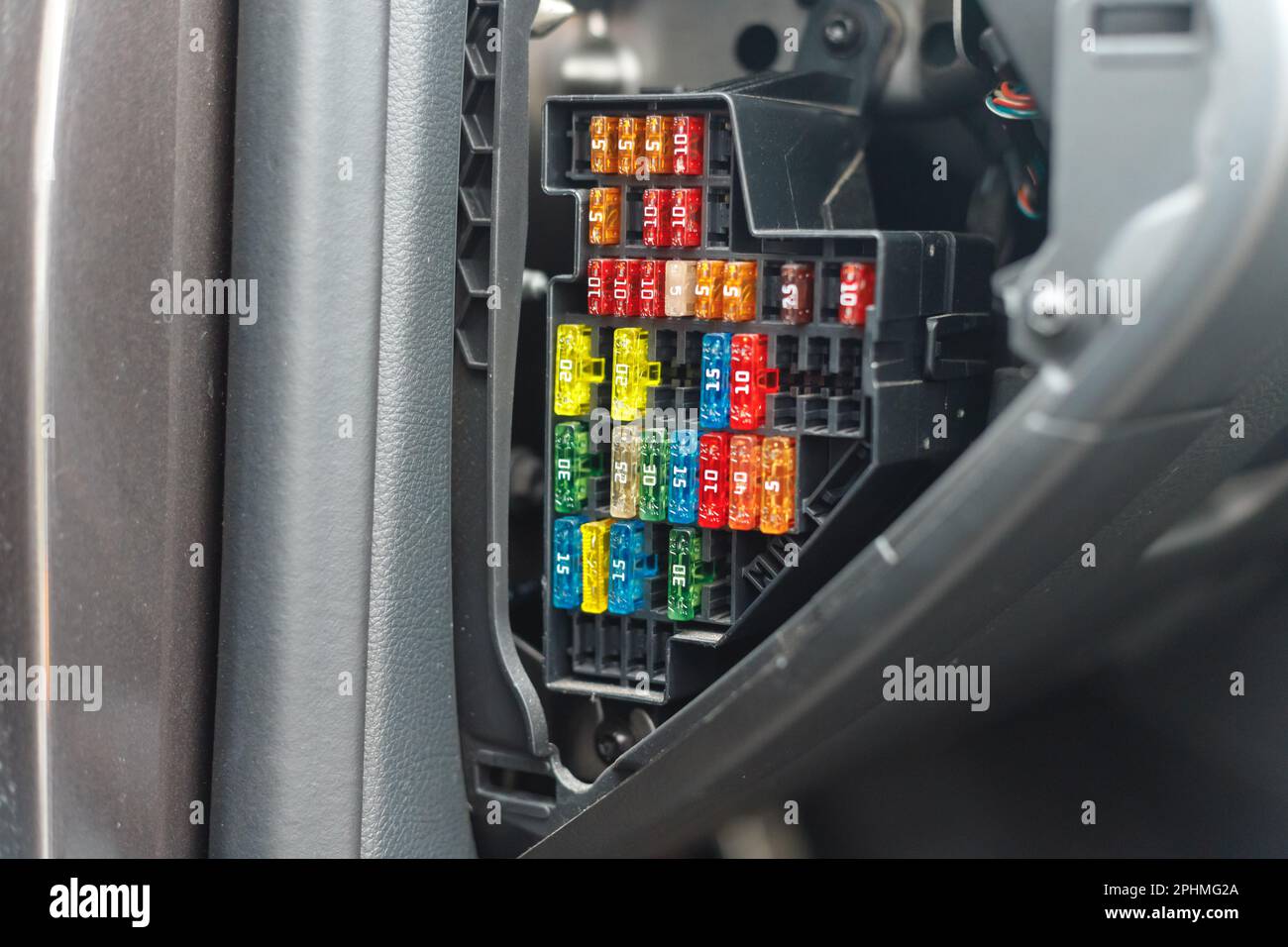 Car fuse box multicolor and multi protection current fused, Power distribution box in car dashboard Stock Photo