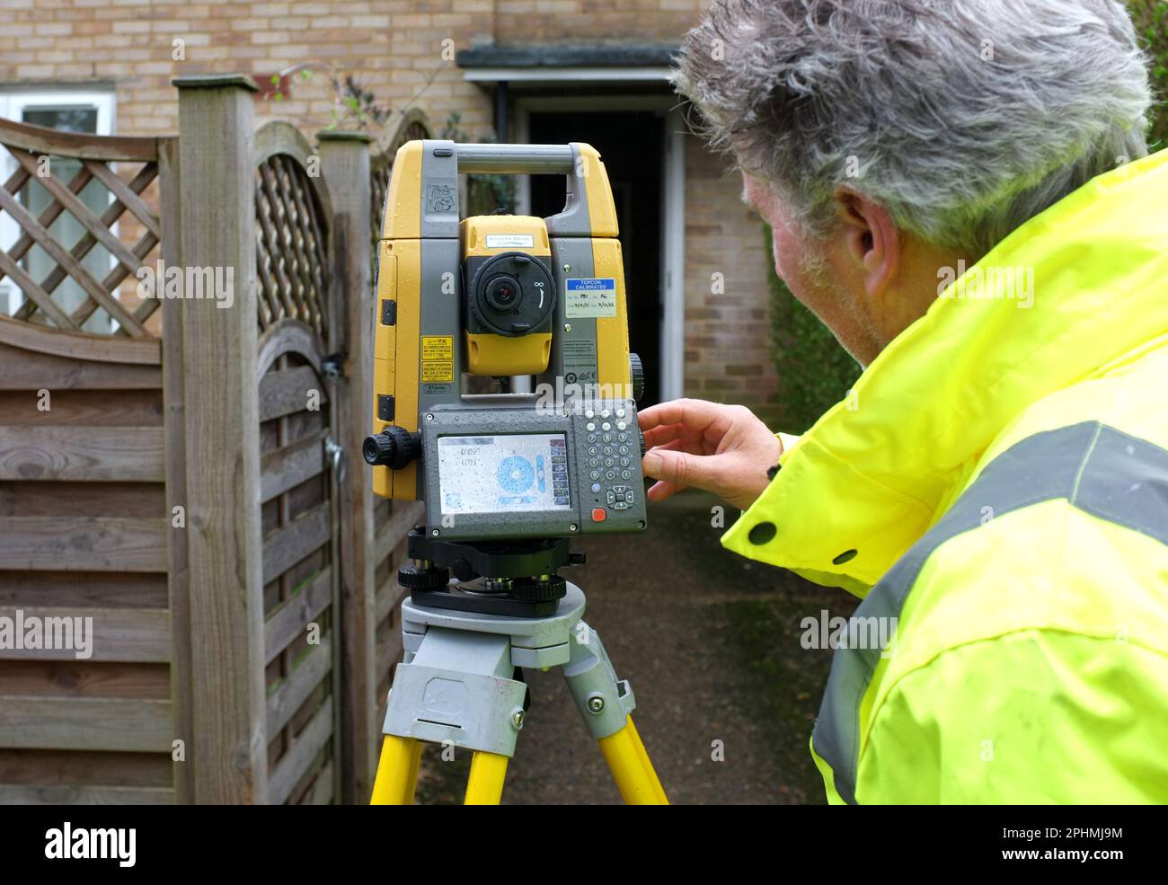A Land Surveyor carries out his work with a Total Station or Theodolite