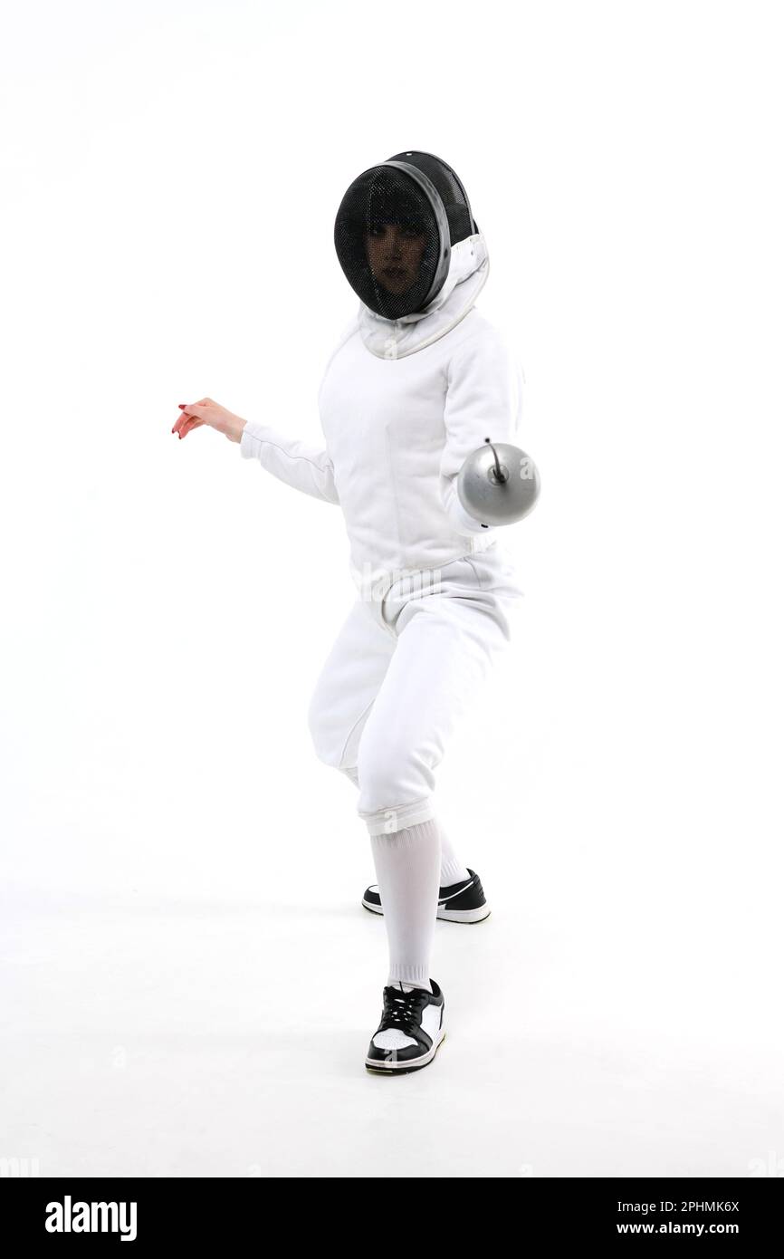 Woman in a fencing costume with a sword in hand isolated on white