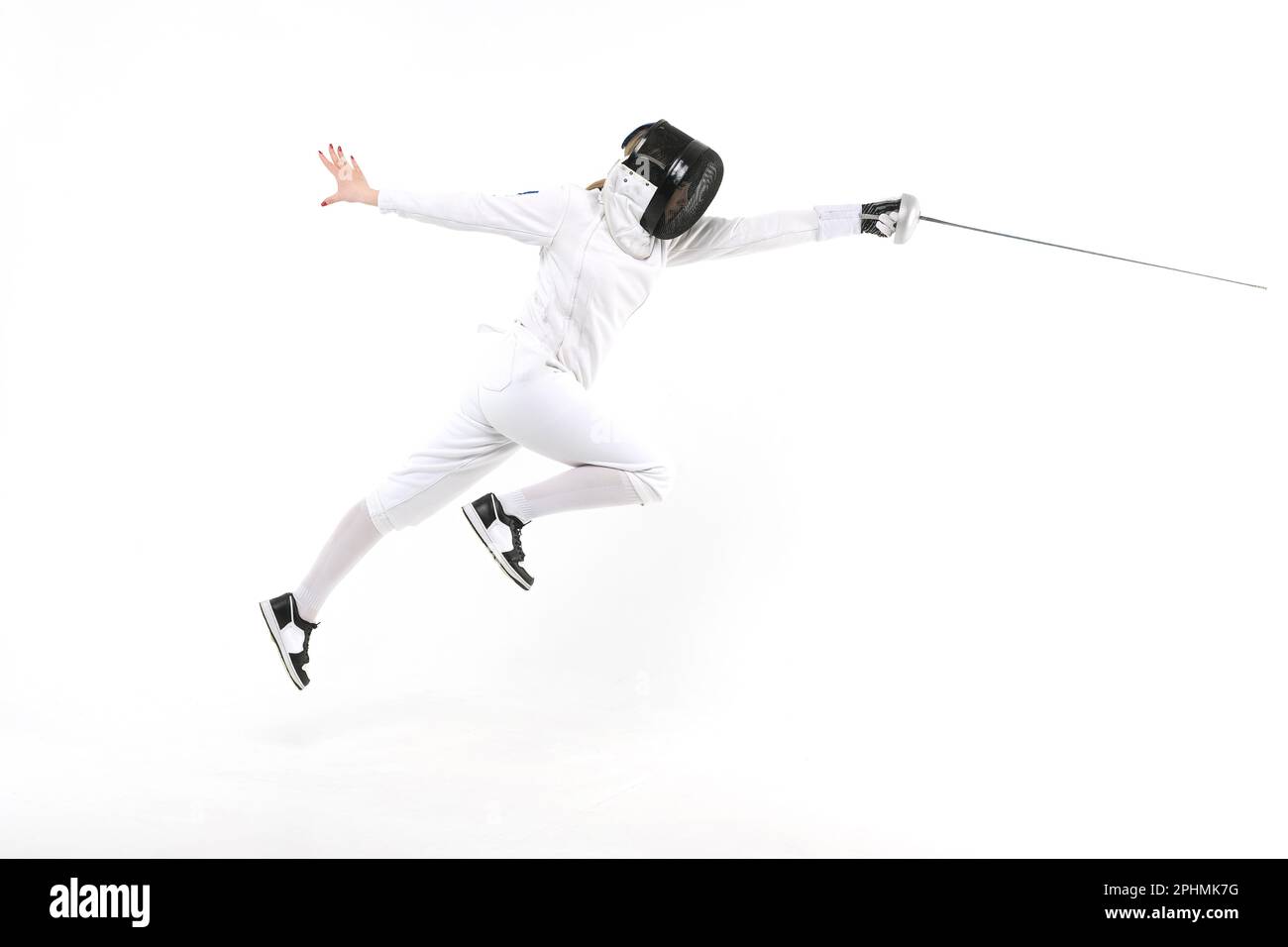 Woman in a fencing costume with a sword in hand isolated on white