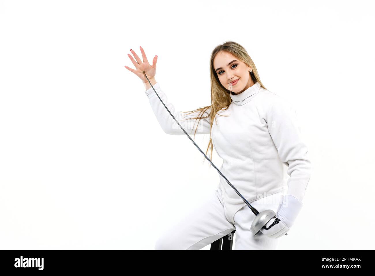 Teen girl in fencing costume with sword in hand isolated on white