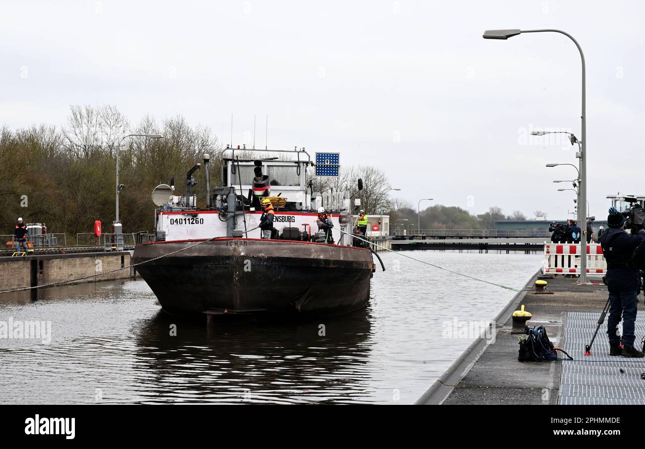 29 March 2023, Bavaria, Wörth An Der Donau: A wrecked ship is floating in the Geisling lock. After the ship has been made buoyant again, the lock chamber is slowly filled in order to get the casualty out of the lock. Photo: Felix Hörhager/dpa Stock Photo