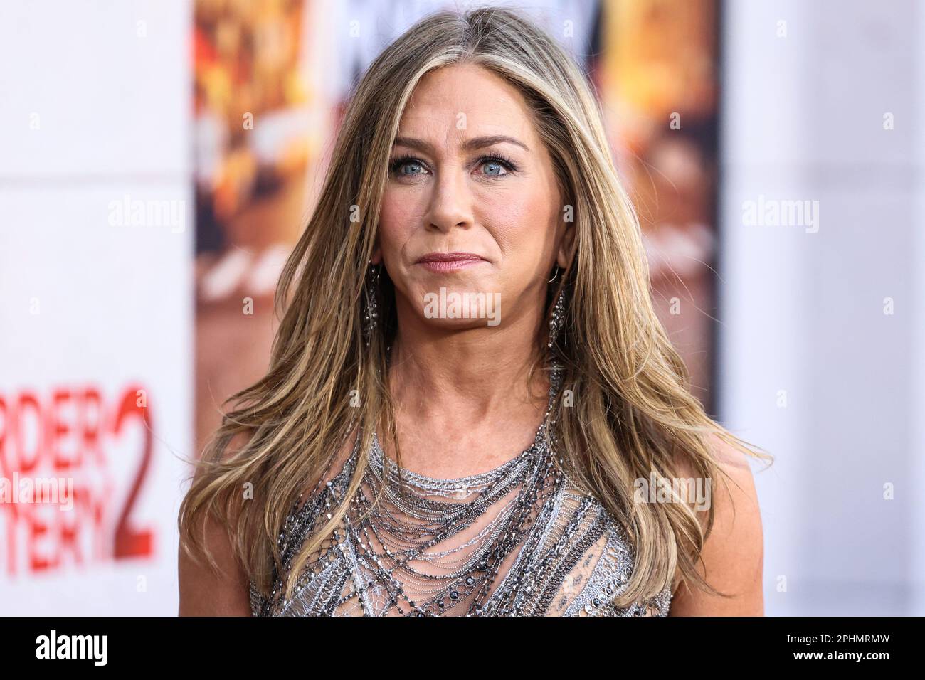 WESTWOOD, LOS ANGELES, CALIFORNIA, USA - MARCH 28: American actress and producer Jennifer Aniston wearing Versace arrives at the Los Angeles Premiere Of Netflix's 'Murder Mystery 2' held at the Regency Village Theatre on March 28, 2023 in Westwood, Los Angeles, California, United States. (Photo by Xavier Collin/Image Press Agency) Stock Photo