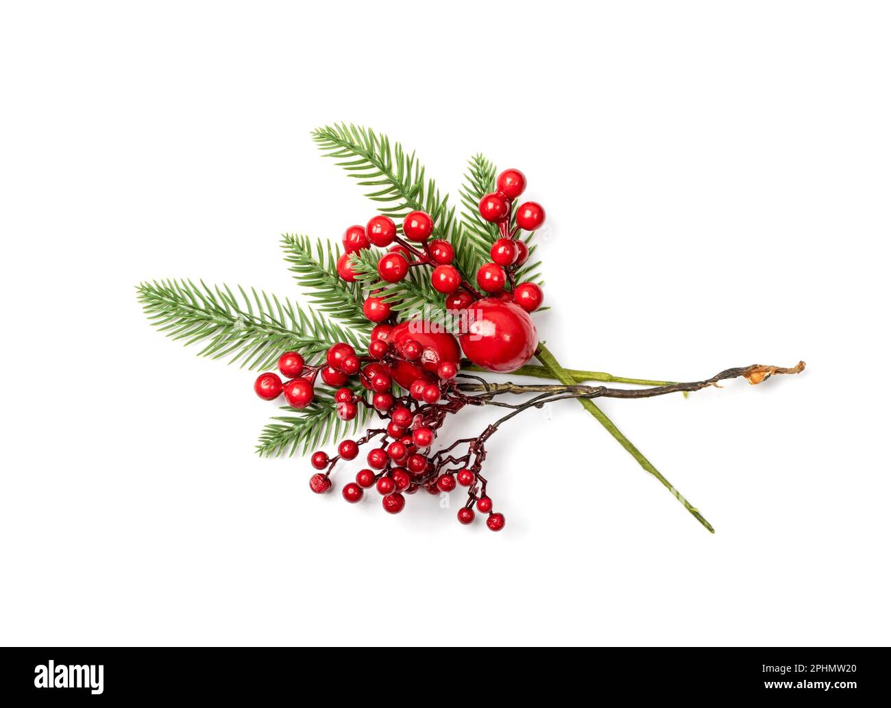 Christmas branch with red berries. Artificial home decoration plant, rowan, ashberry or kalina twig isolated on white background Stock Photo