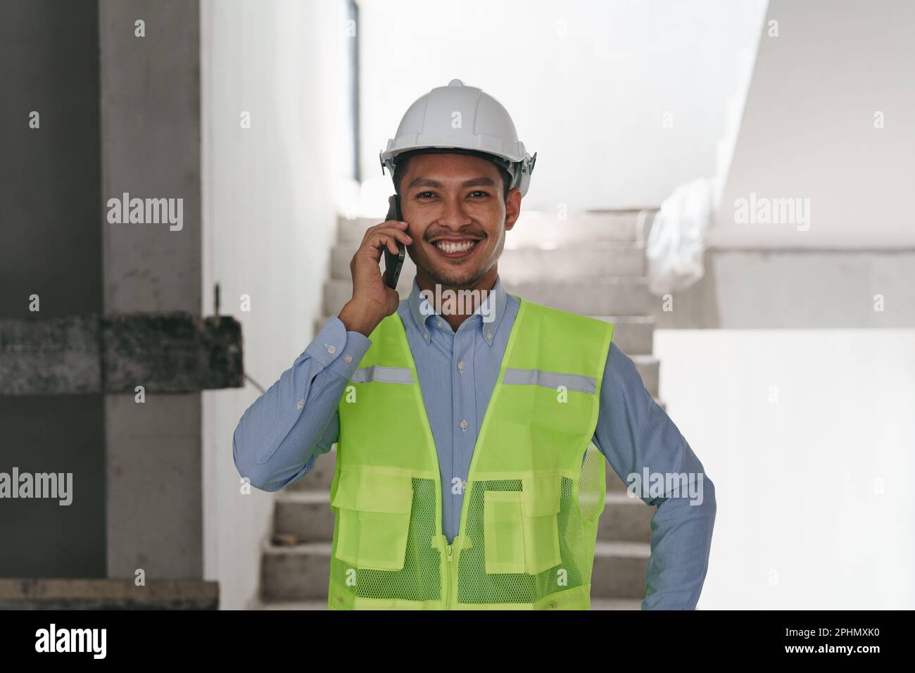 Asian Engineer working and quality check at construction site. Asian foreman  construction standing at construction office Stock Photo - Alamy