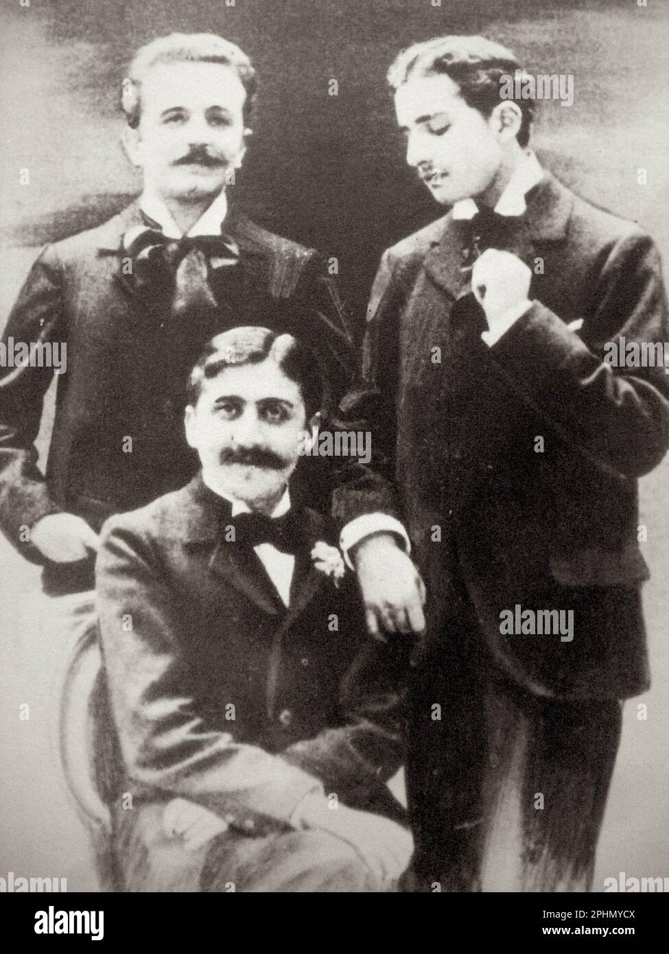 Marcel Proust (seated), Robert de Flers (left), and Lucien Daudet (right), ca. 1894 Stock Photo