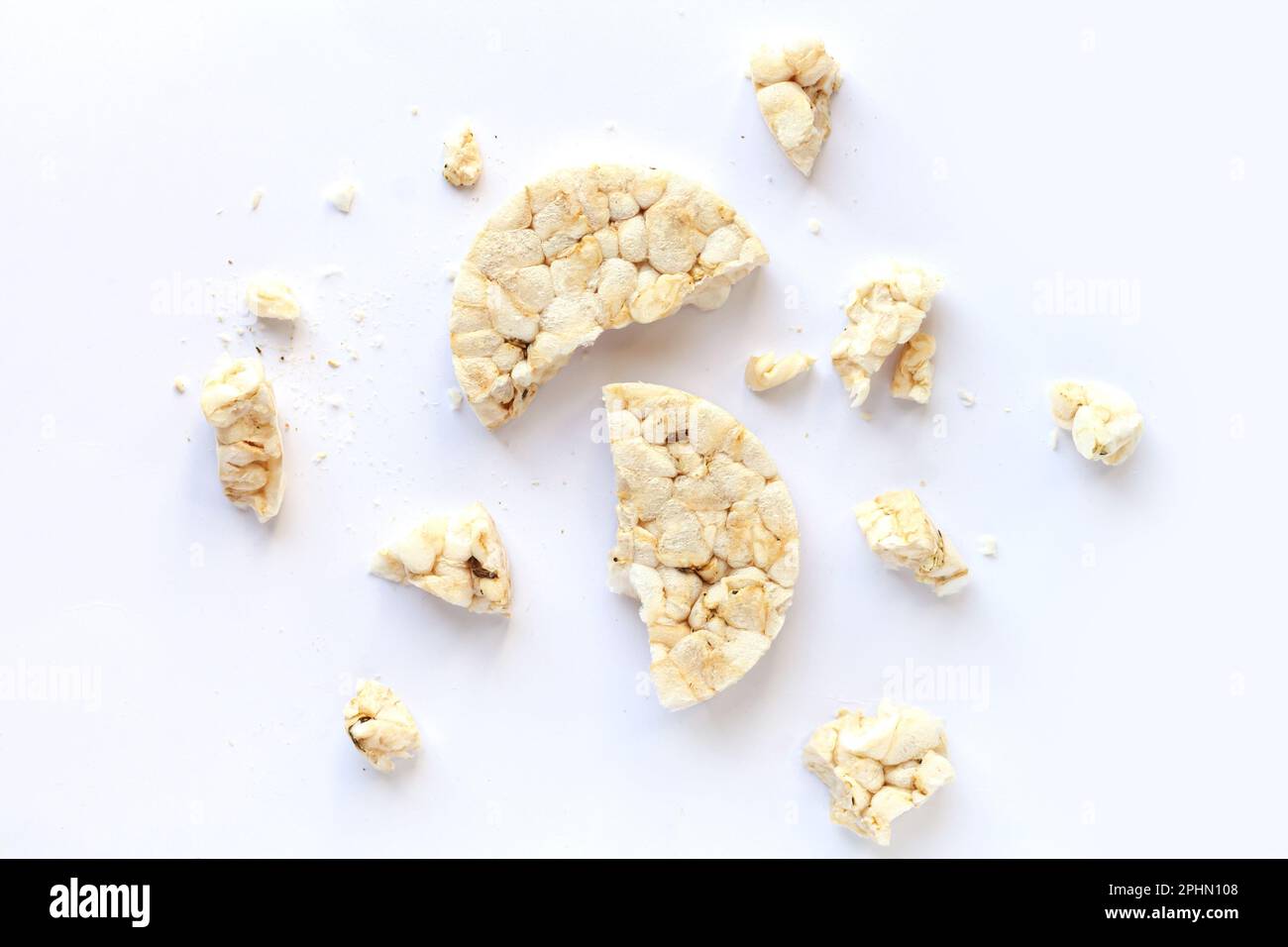 Broken puffed rice cracker isolated on white background. Top view Stock