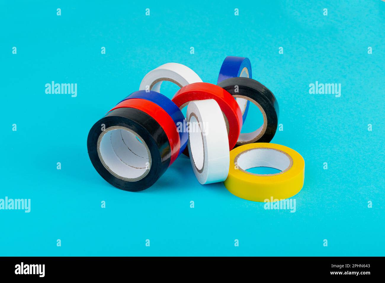 Colorful Electrical Tape, Plastic Duct Tape Rolls, Colored Adhesive Tapes on Blue Background