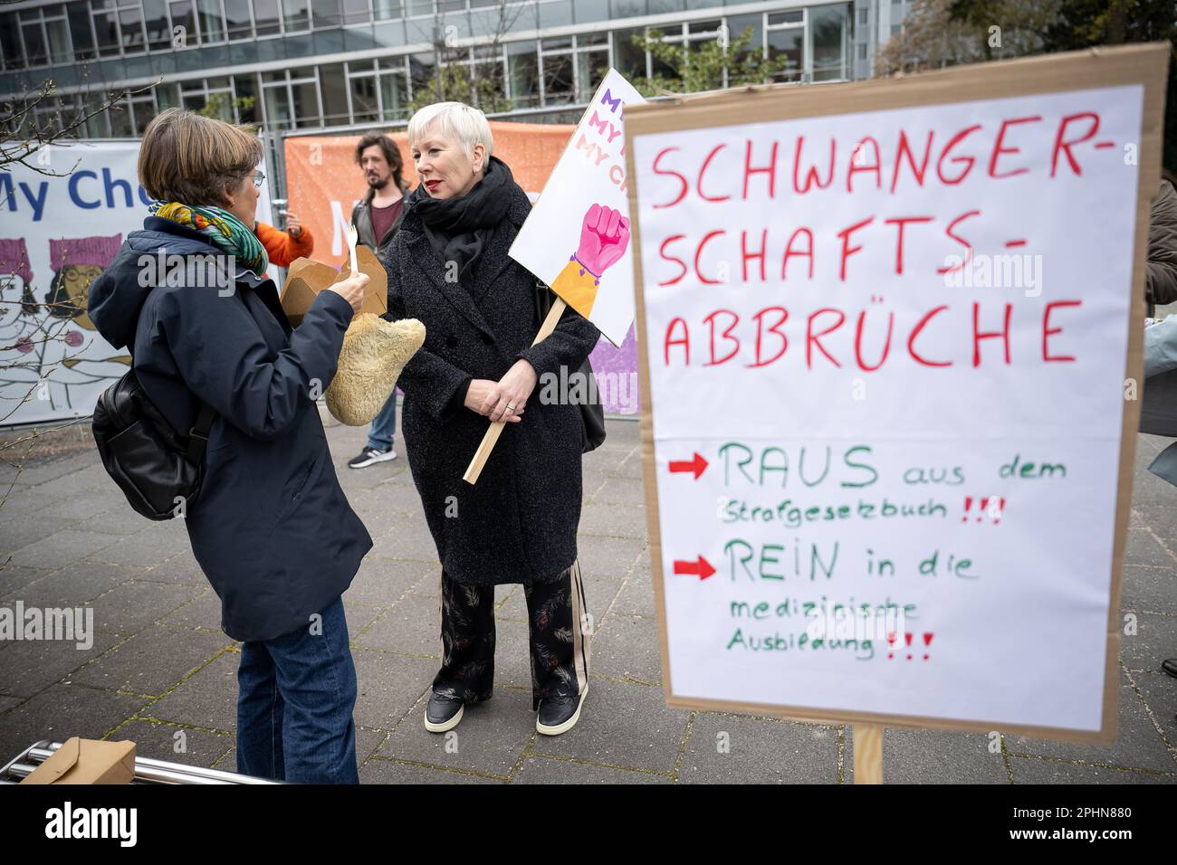 29 March 2023, Hesse, Frankfurt/Main: A woman talks to Gabriele Wenner ...