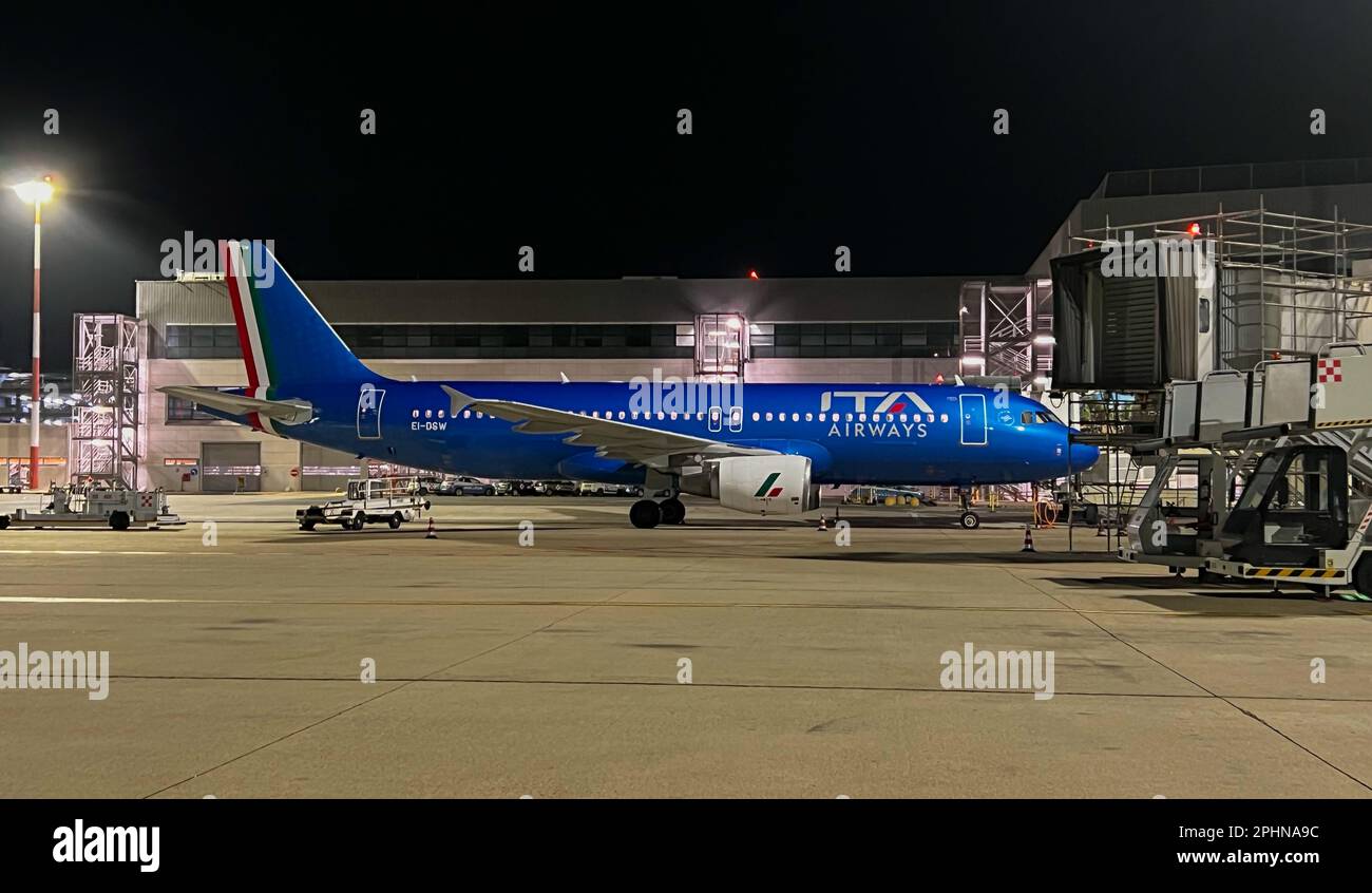 airplane ready for departure with passengers boarding flight Stock