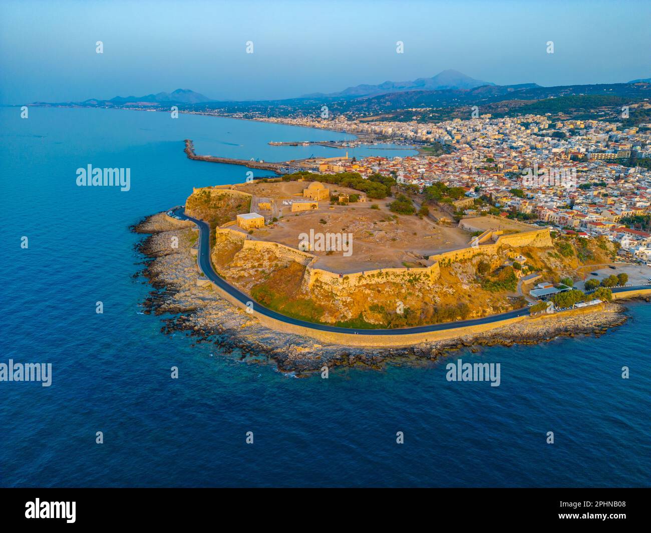 Sunset aerial view of Venetian Fortezza Castle in Greek town Rethimno ...