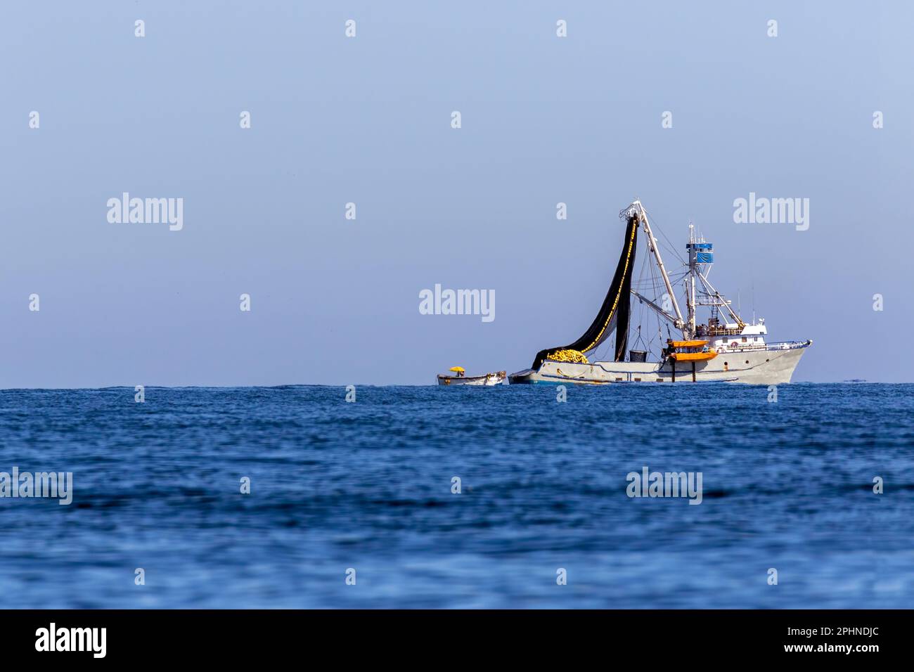Large commercial fishing boat with nets hi-res stock photography