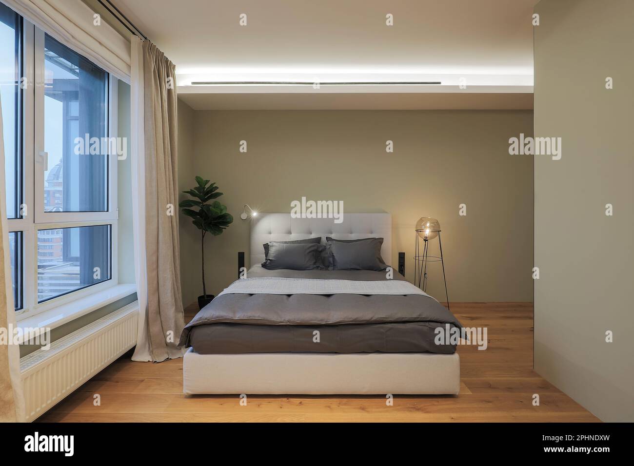 Double bed in a modern bedroom interior design Stock Photo - Alamy