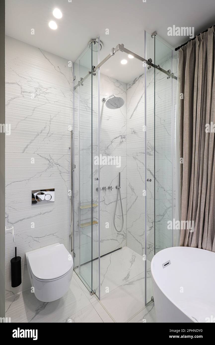 Bathroom interior with shower cabin and white toilet bowl Stock Photo ...