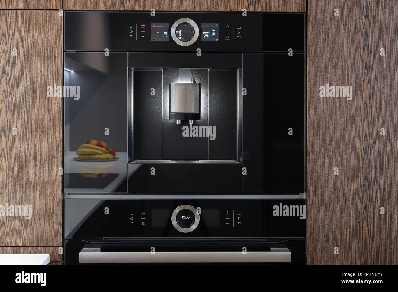 Builtin fully automatic coffee machine in kitchen furniture Stock