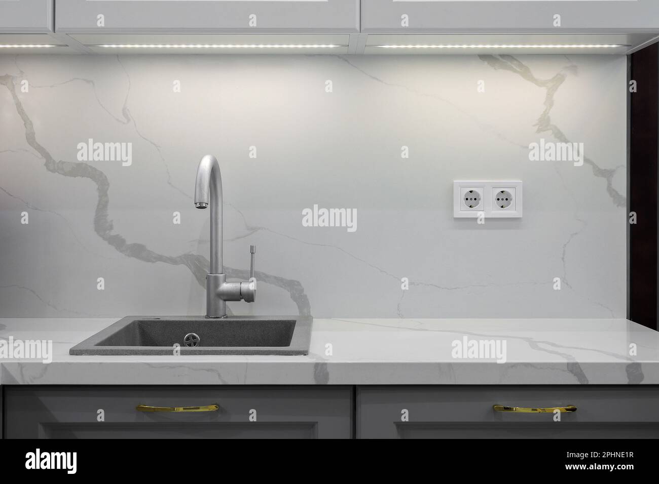 Faucet and granite sink in the modern kitchen Stock Photo Alamy