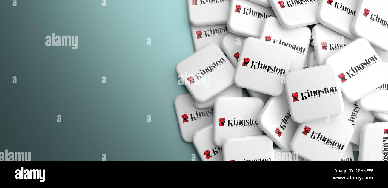 Logos of the computer memory company Kingston on a heap on a table. 