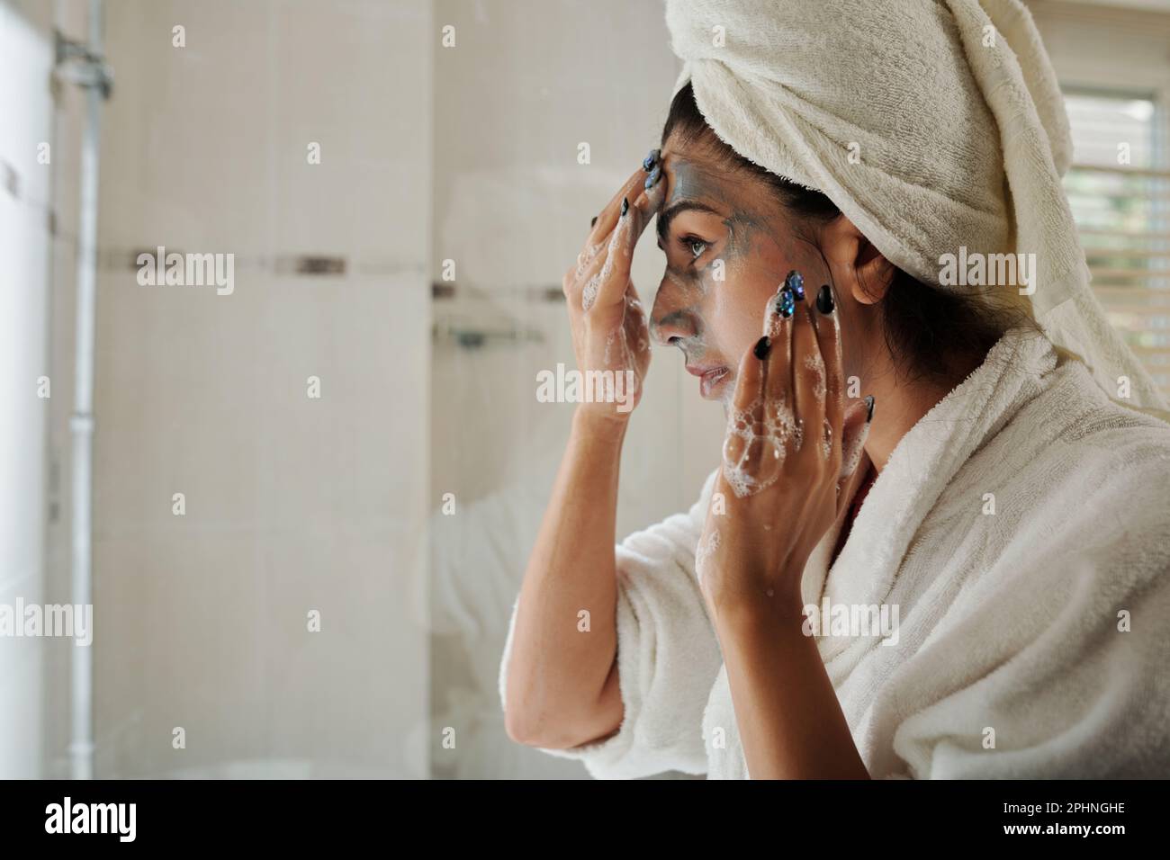Woman peeling off mask hi-res stock photography and images - Alamy