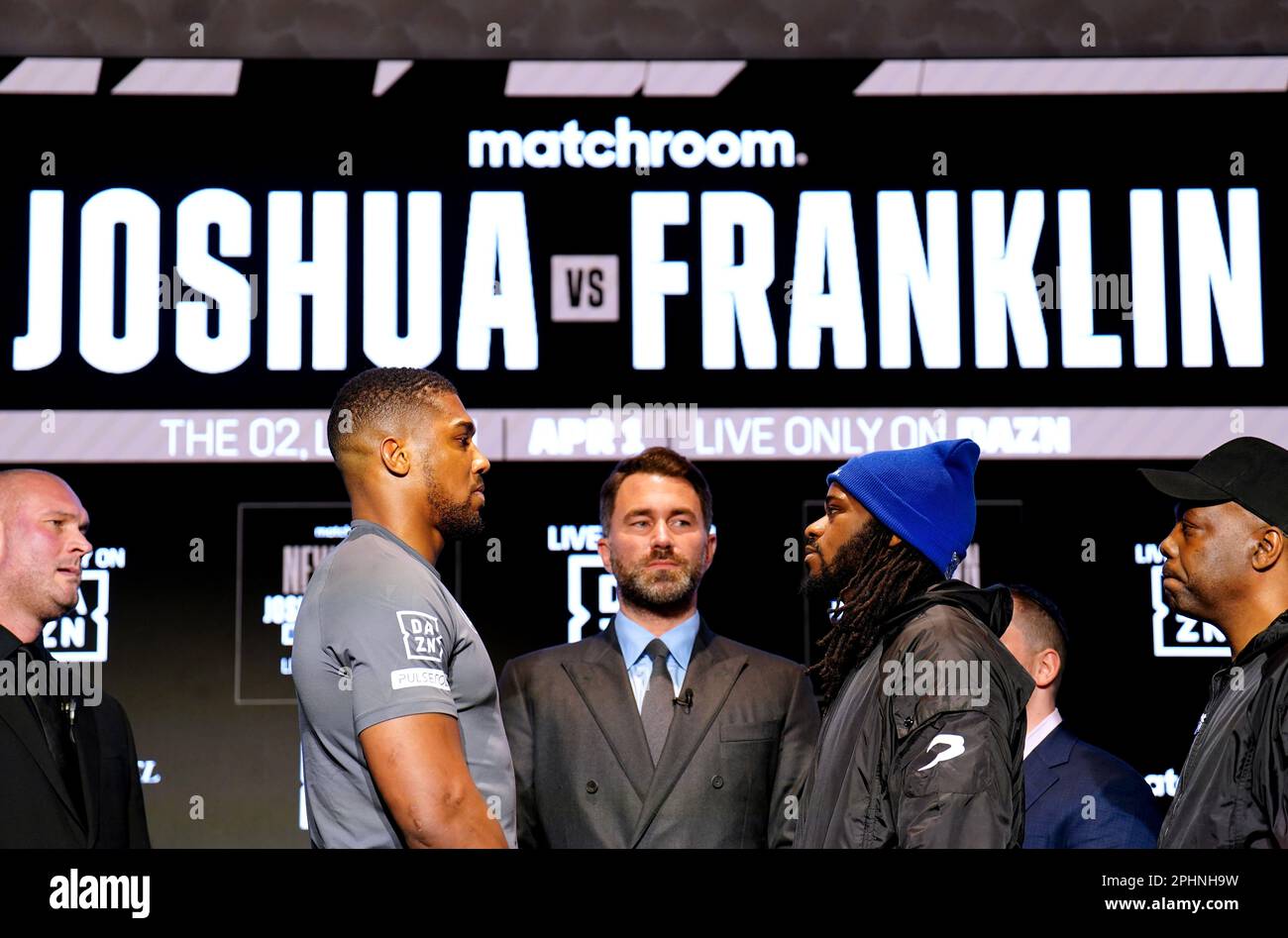 Boxing promoter Eddie Hearn stands in the centre as Anthony Joshua and Jermaine Franklin face off during a press conference at Nobu Hotel London Portman Square, London. Picture date: Wednesday March 29, 2023. Stock Photo