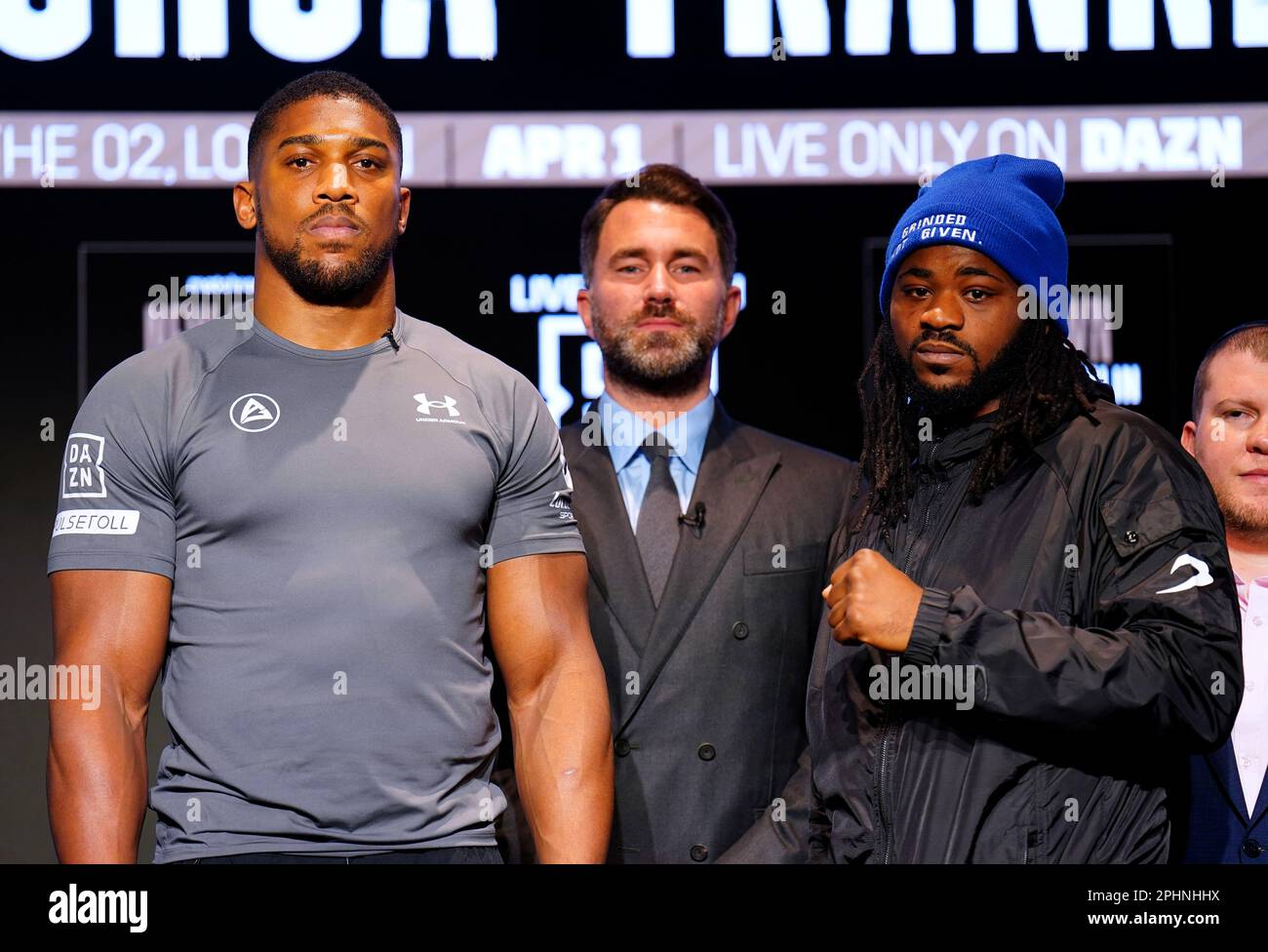 Boxing promoter Eddie Hearn stands in the centre of Anthony Joshua and Jermaine Franklin during a press conference at Nobu Hotel London Portman Square, London. Picture date: Wednesday March 29, 2023. Stock Photo