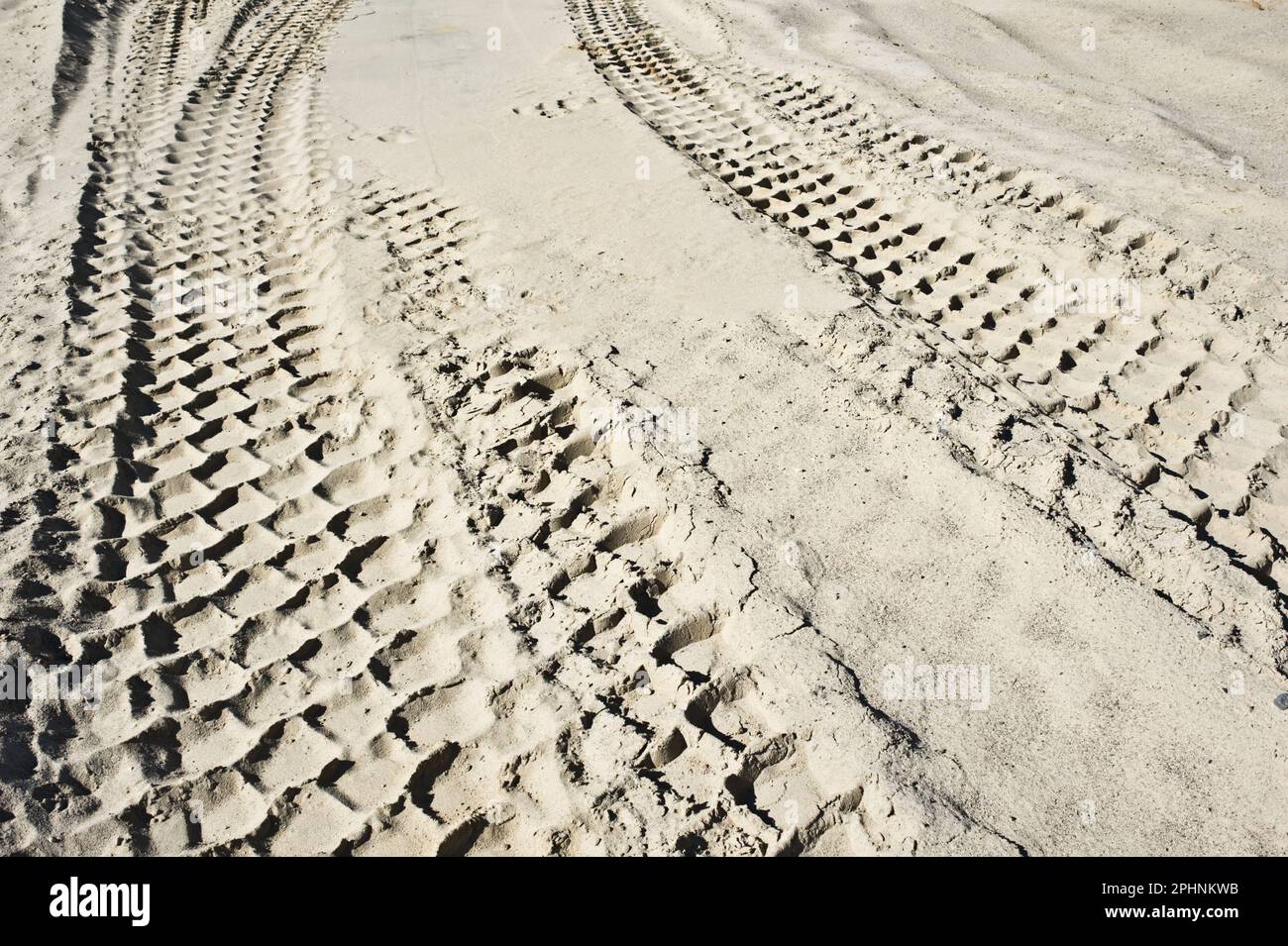 Tire tracks in the sand. Stock Photo