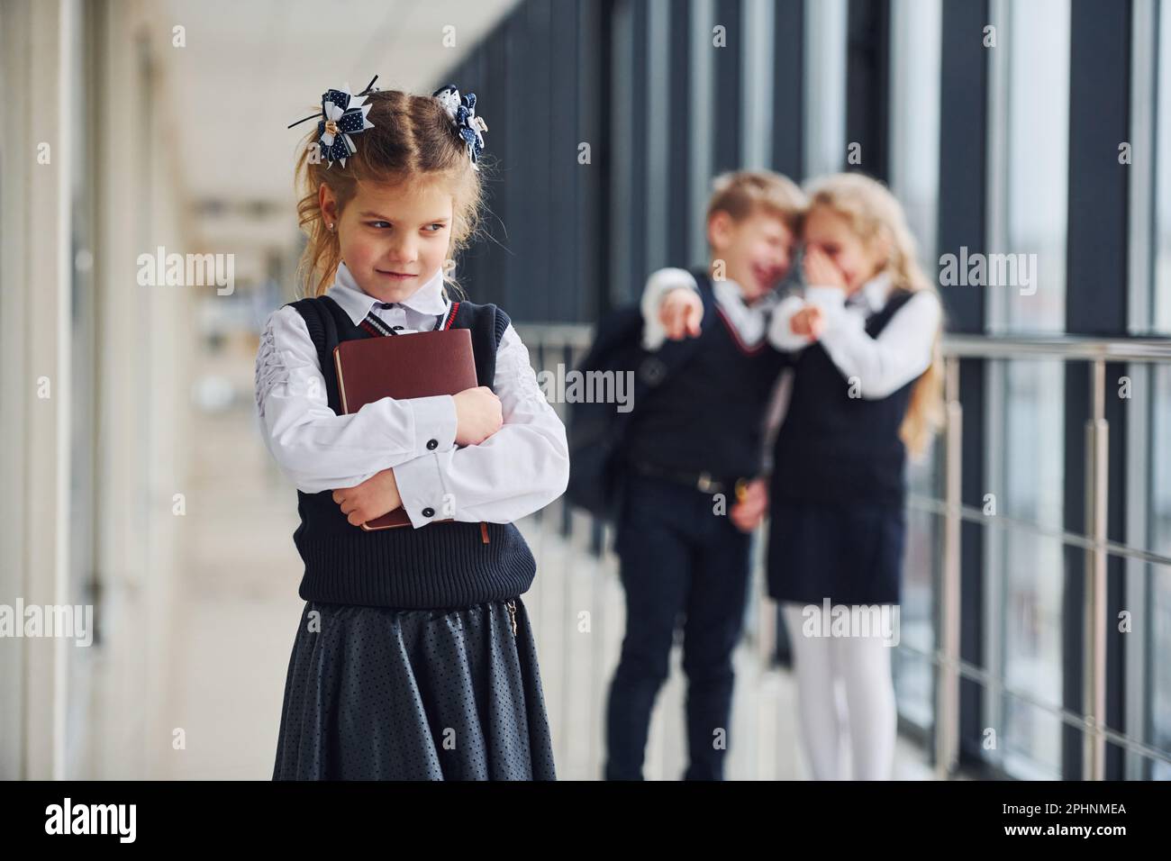 Little girl gets bullied. Conception of harassment. School kids in