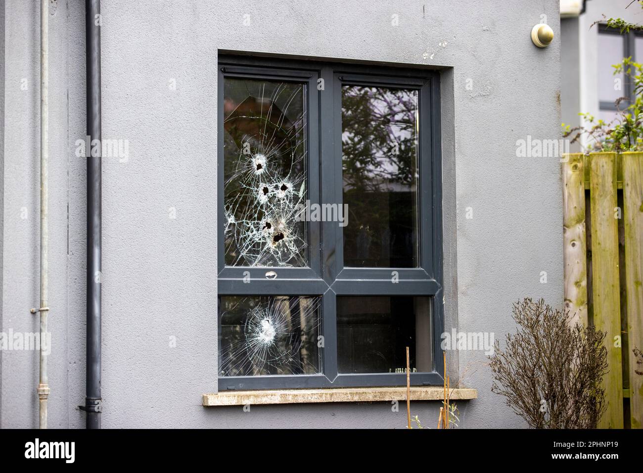 A broken window on Donaghadee Road in Newtownards. Several more properties have been attacked in Co Down in incidents linked to an ongoing feud between rival loyalist paramilitary drug gangs. Police believe the petrol bomb and brick-throwing incidents on Tuesday evening in the Bangor and Newtownards area are part of the recent dispute between drug dealing factions of the Ulster Defence Association. Stock Photo