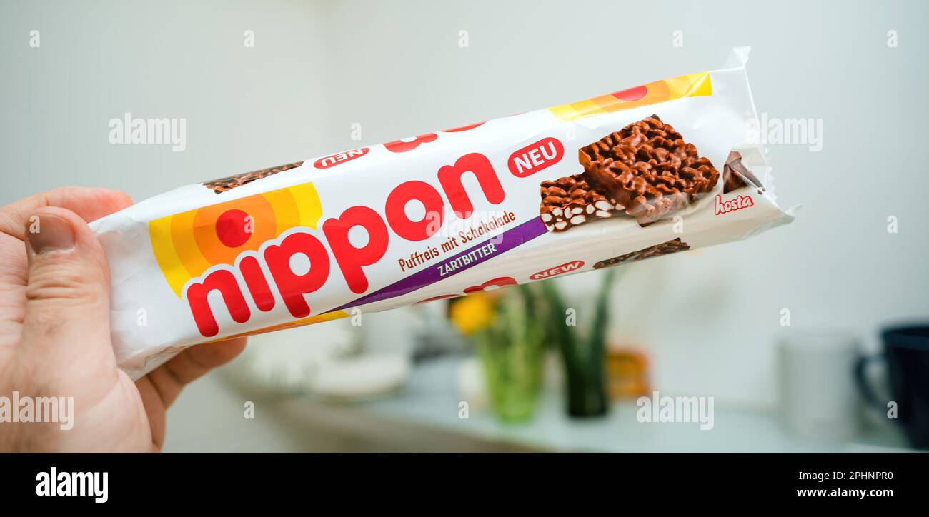 Paris, France - MAr 18, 2023: POV male hand holding package with Nippon ...
