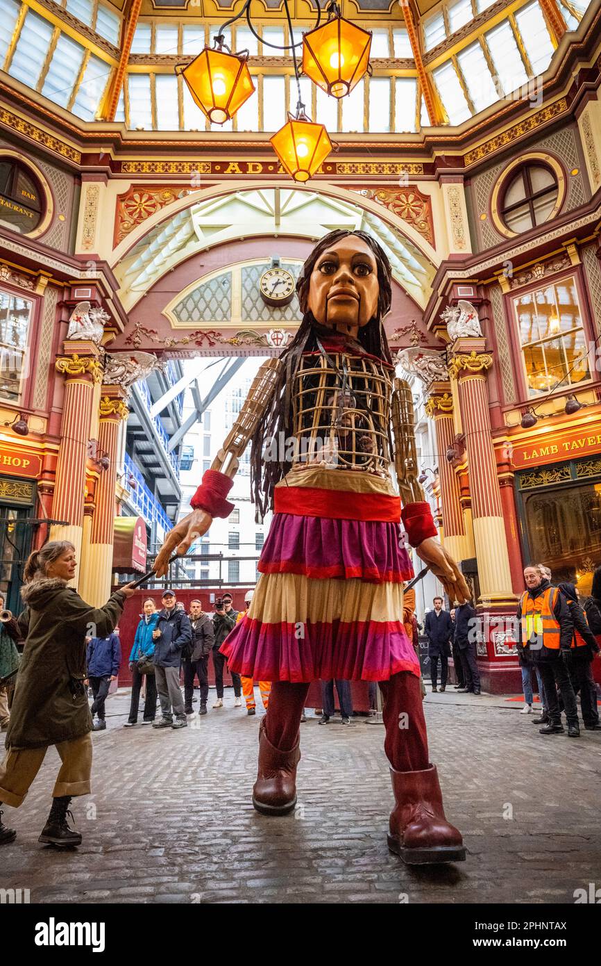 London, UK.  29 March 2023.  Little Amal, a 3.5m puppet of a 10 year old Syrian refugee girl, takes a walk around Leadenhall Market in the City of London to raise fund for displaced children, including those affected by the recent earthquakes in Turkey and Syria.  Starting her journey last year at the Syrian border, Amal has become a global symbol of human rights, especially those of young refugees separated from their families.  Little Amal will continue her walk over the weekend in London and Brighton.  Credit: Stephen Chung / Alamy Live News Stock Photo