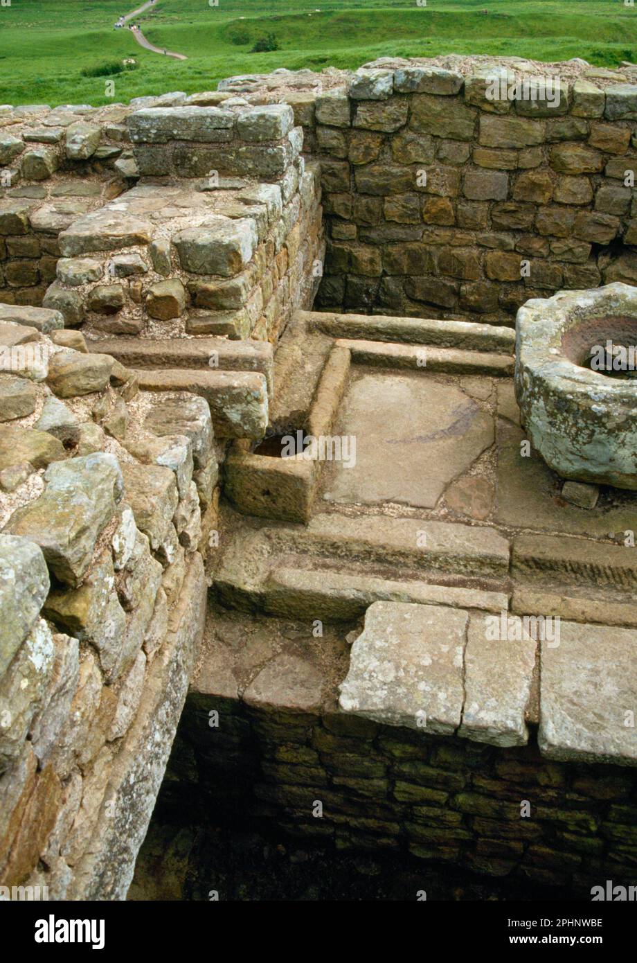 Housesteads Roman Fort, Hadrian's Wall, drains and stone basin in Latrine block Stock Photo