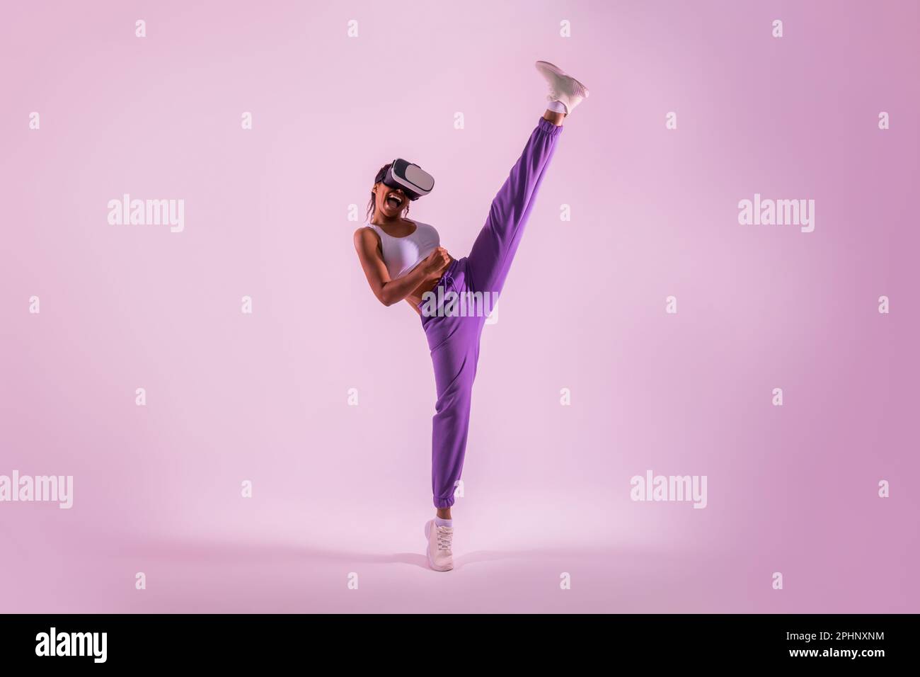Black woman throwing kick in immersive virtual reality game, gaming